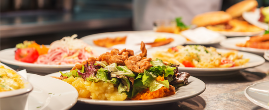 multiple well-plated dishes sitting out